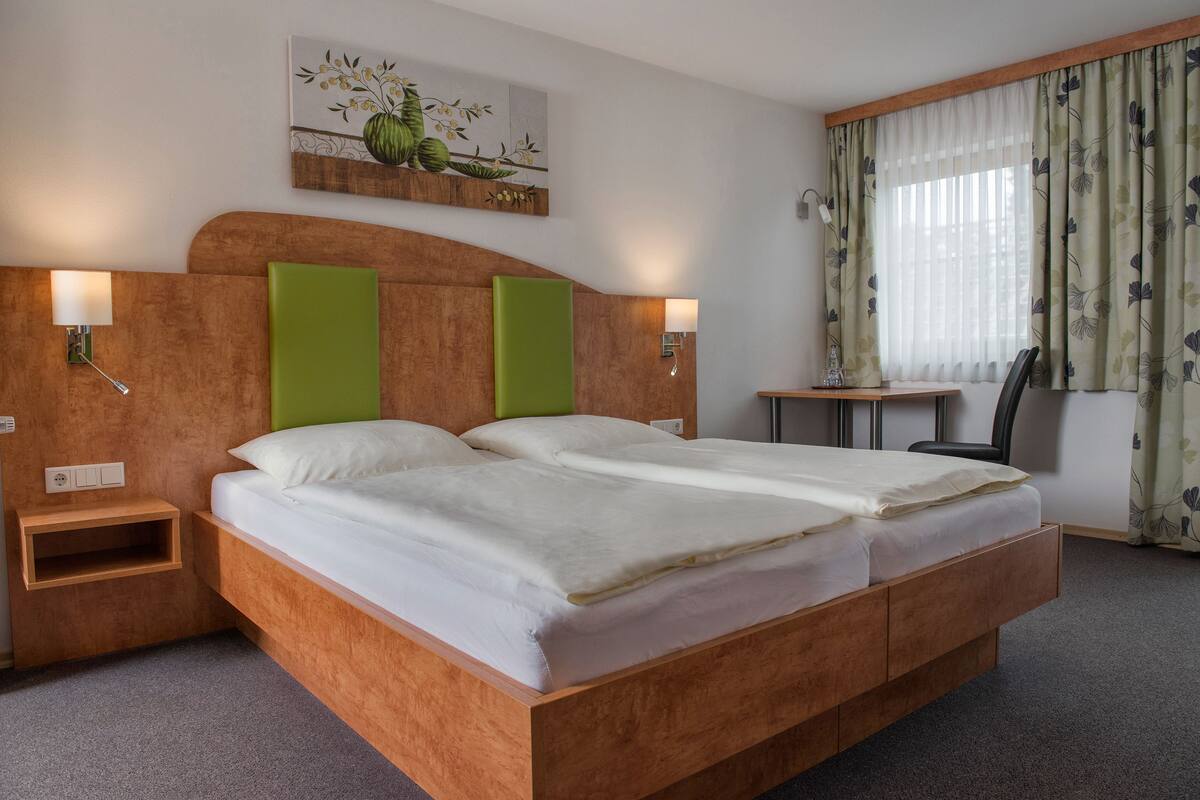 double room | premium bedding, desk, blackout curtains, soundproofing