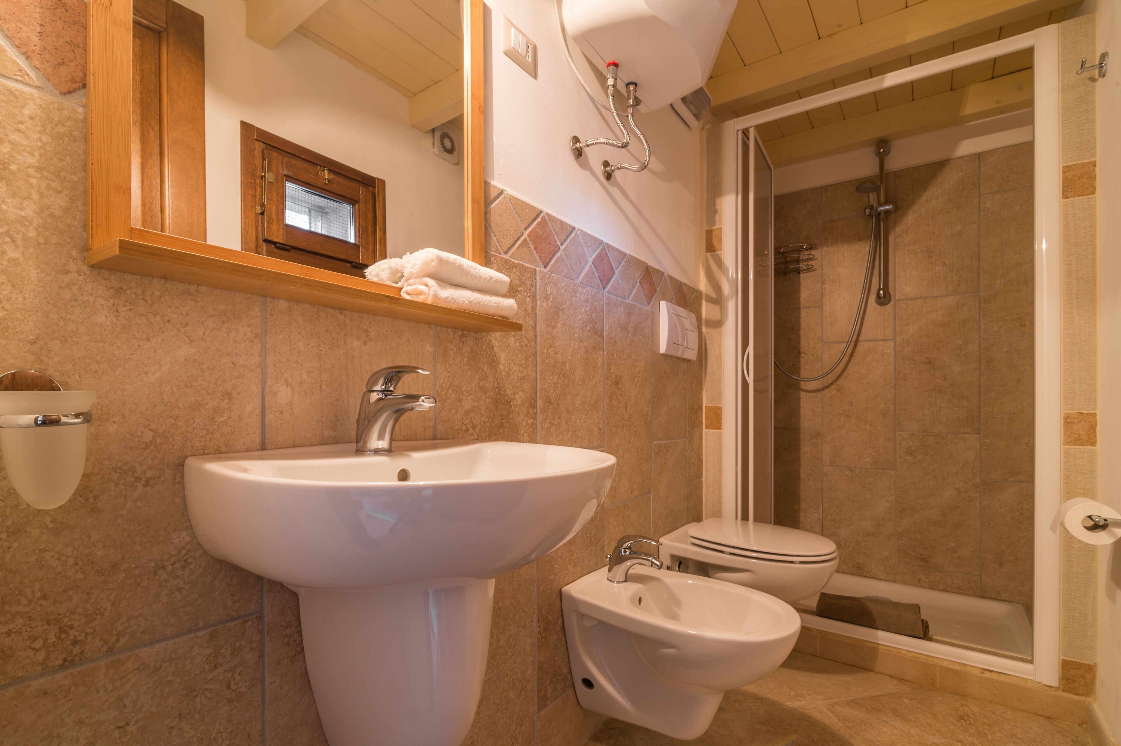 Apartment, 1 Bedroom (Casa Pedra) | Bathroom | Shower, hair dryer, bidet, towels