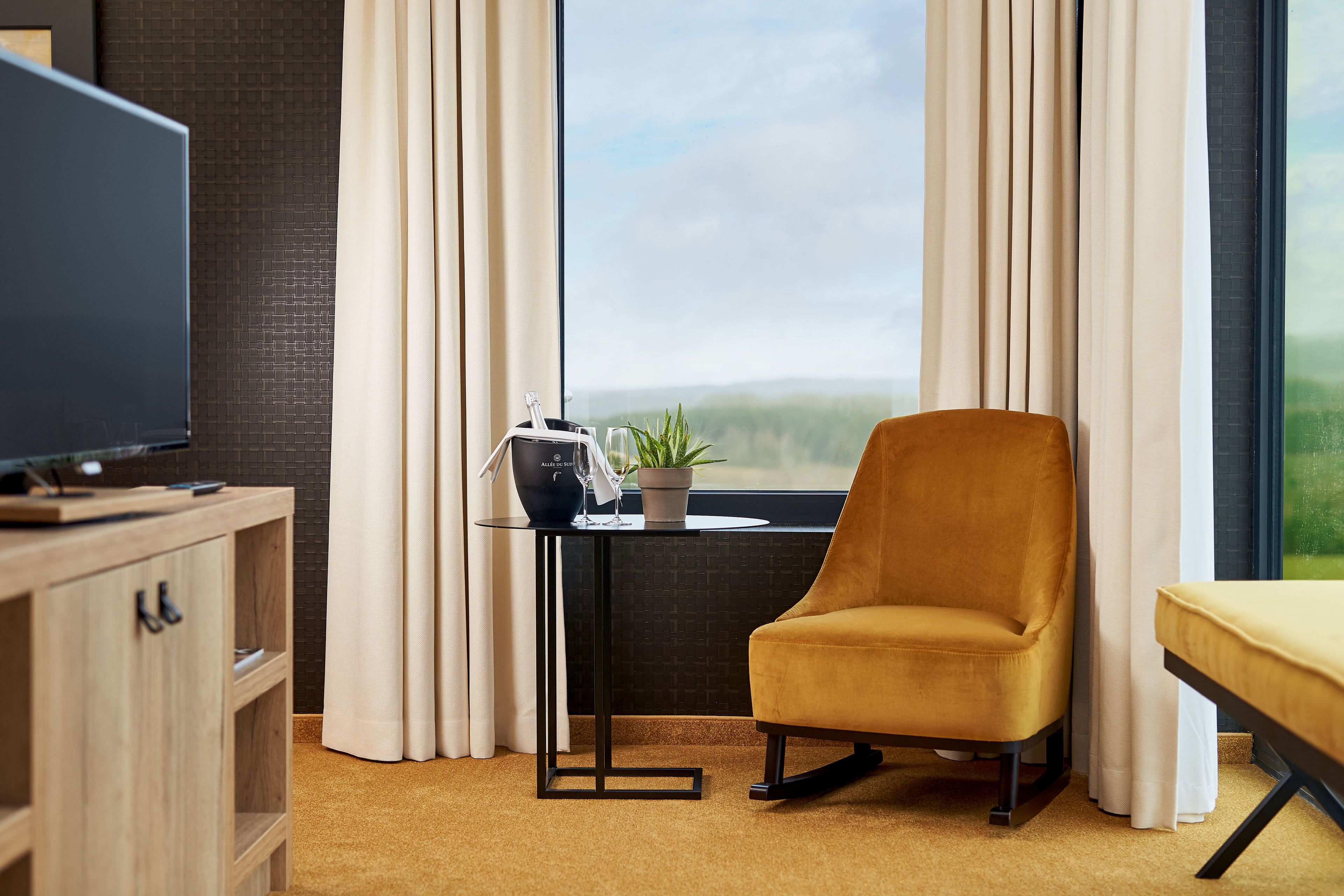 executive double or twin room | living area | flat-screen tv, table football