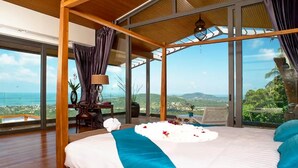 A spacious bedroom with a large bed, a view of the ocean, and a wooden ceiling structure. - 9 Bedroom Sea View Villa Blue SDV080A-By Samui Dream Villas (Koh Samui)