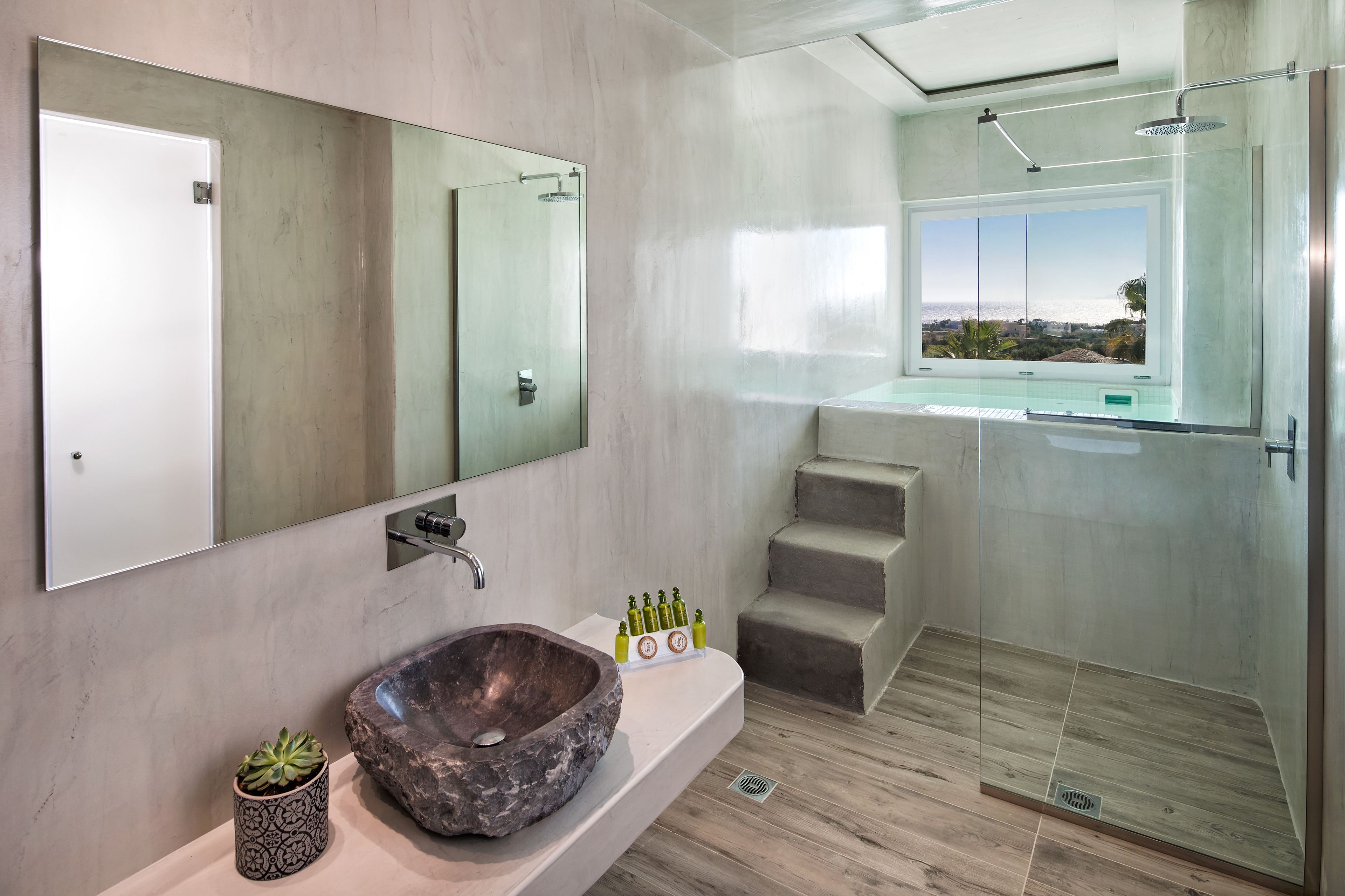 honeymoon suite, hot tub, sea view | bathroom | separate bathtub and shower, free toiletries, hair dryer, slippers