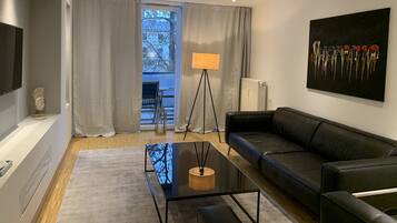 Luxury Apartment, 2 Bedrooms, Accessible, Balcony | Living area | Flat-screen TV, pay films, offices