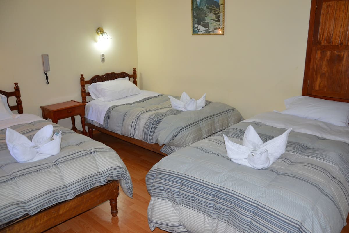 Quadruple Room | In-room safe, desk, soundproofing, iron/ironing board