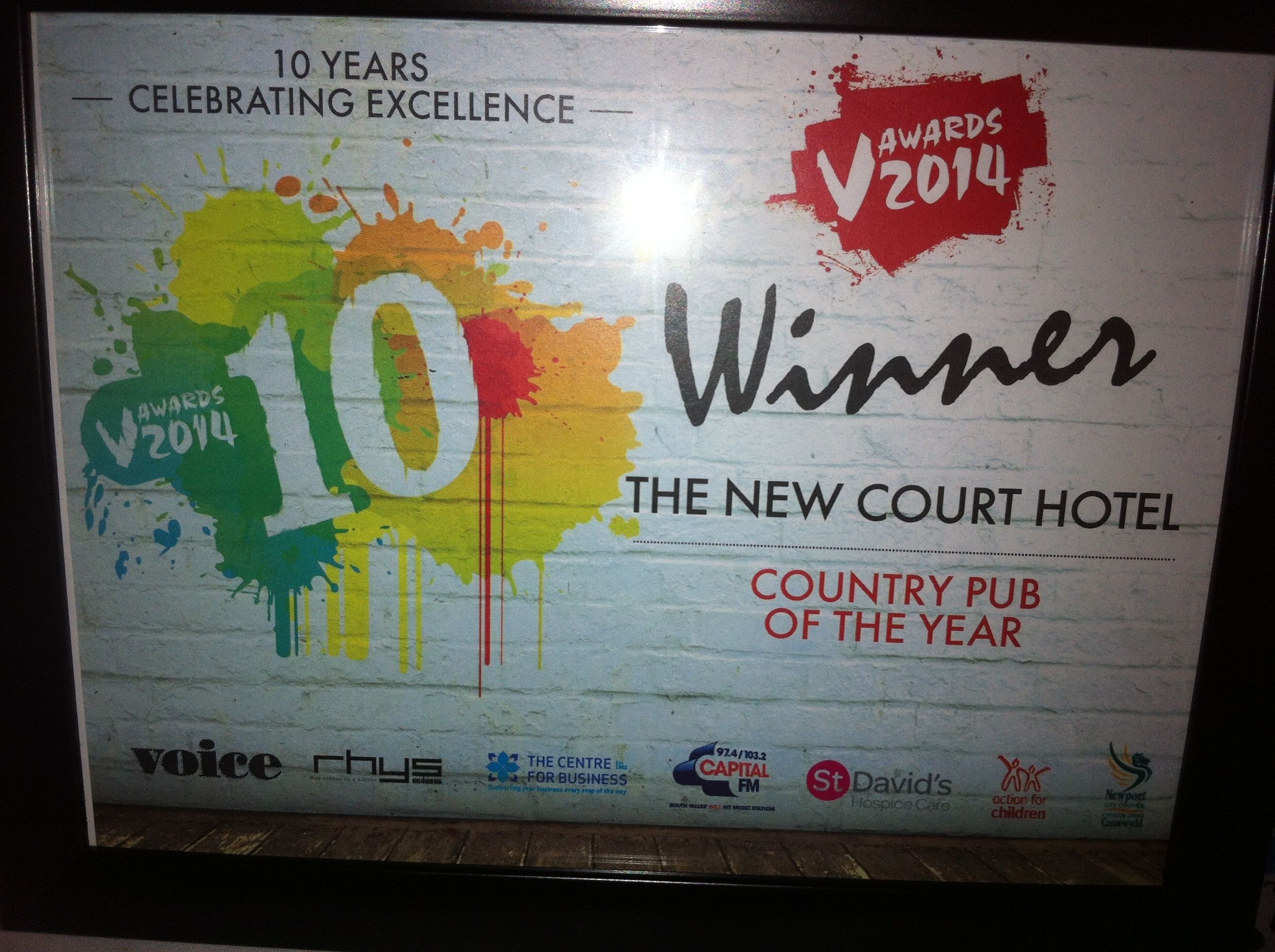 A framed award plaque for the New Court Hotel, titled "Winner Country Pub of the Year" for the Awards 2014.