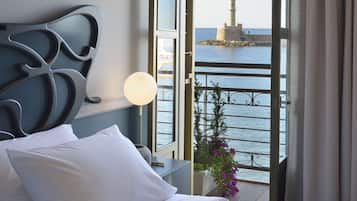 Deluxe Room, Balcony, Sea View | In-room safe, desk, soundproofing, iron/ironing board