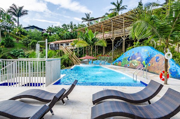 Outdoor pool, open 9:00 AM to 8:00 PM, pool umbrellas, pool loungers