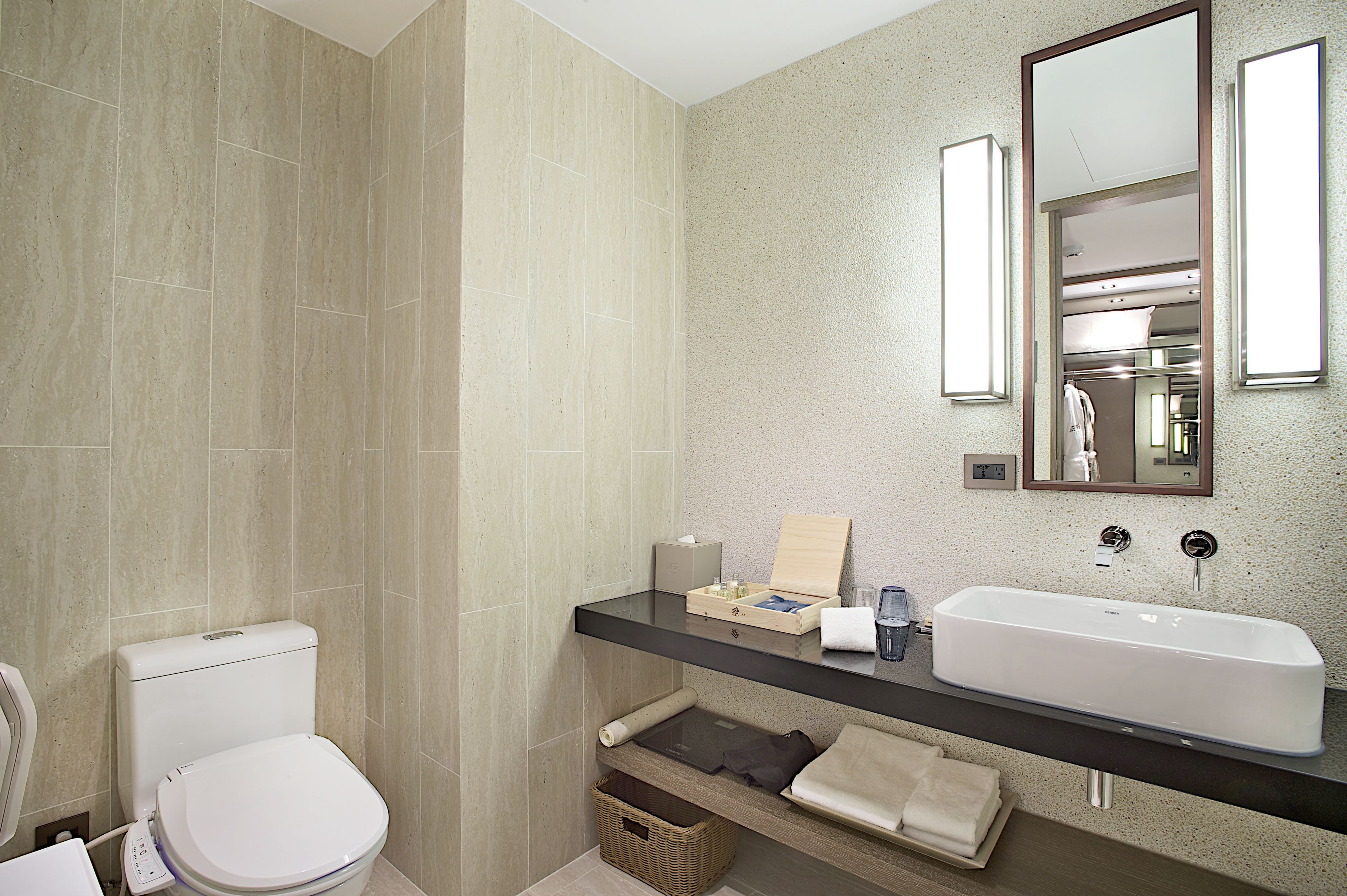 designer toiletries, hair dryer, bathrobes, slippers