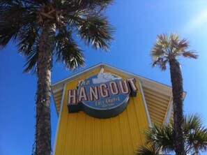 A yellow building with a sign that reads "The Hangout." - Garage Parking included! BEACHFRONT CONDO with A GULF Front MASTER! AWESOME VIEW (Orange Beach)