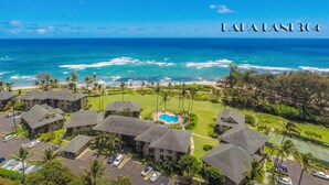 A coastal resort with multiple buildings, a swimming pool, and ocean views. - Kaha Lani #304: Coconut Coast • Pacific Sunrise View • 1BR/1½B • Top Level View (Wailua)