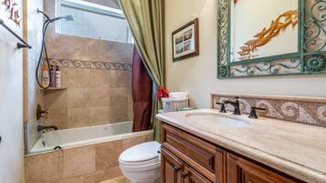 Bathtub, hair dryer, towels, soap