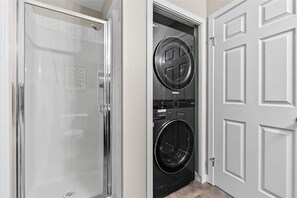 Combined shower/bathtub, hair dryer, towels, soap