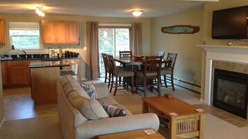 Smart TV, fireplace, books, stereo