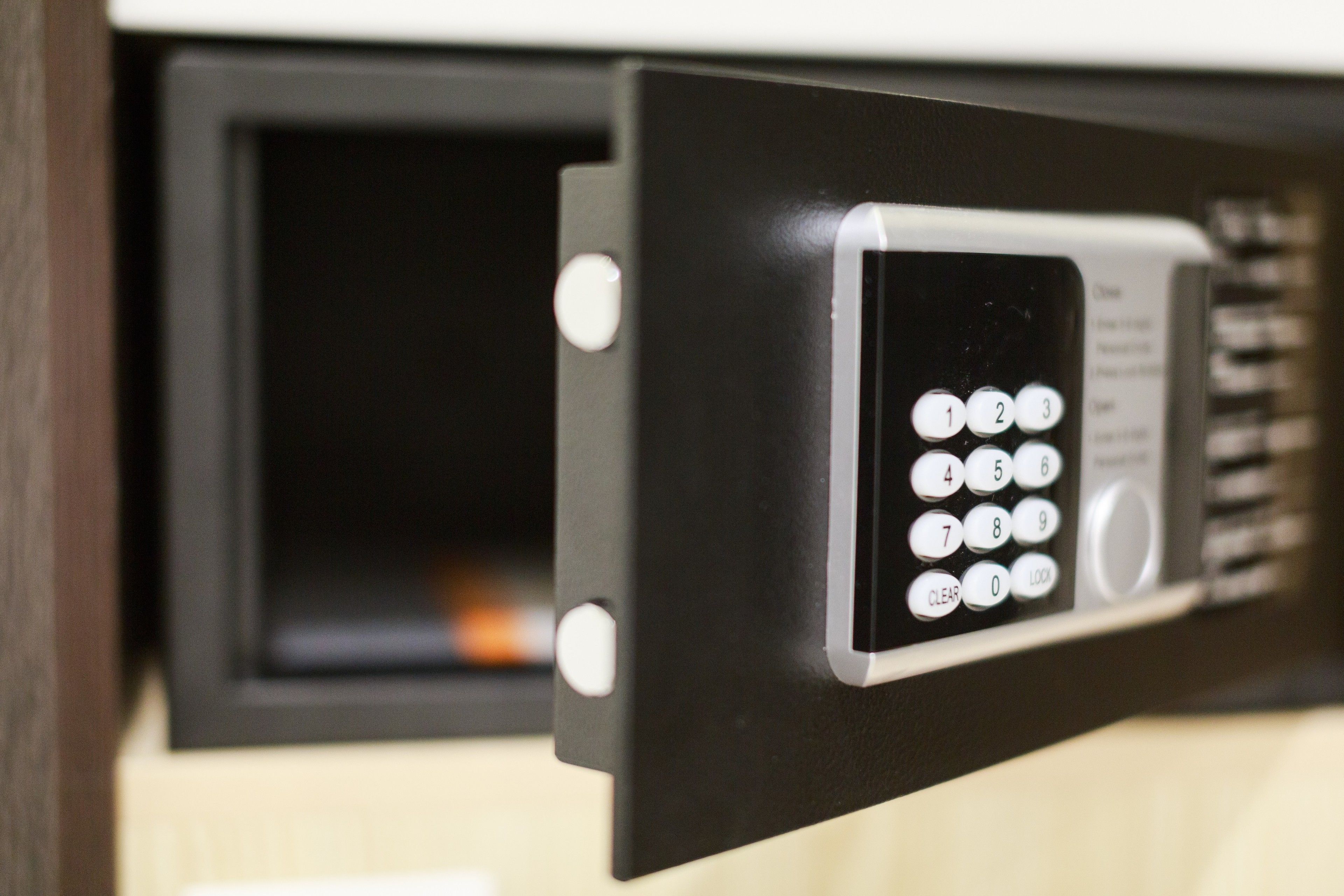 A keypad lock on a door, likely for a secure room or storage area.