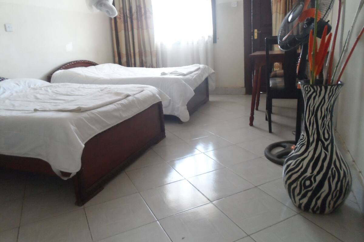 Premium bedding, desk, laptop workspace, iron/ironing board