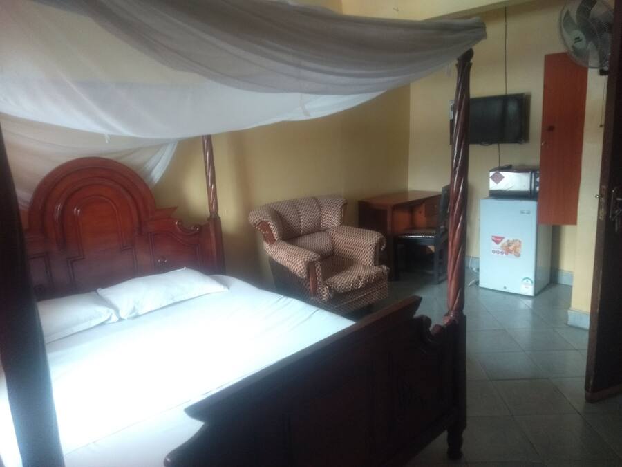 Premium bedding, desk, laptop workspace, iron/ironing board