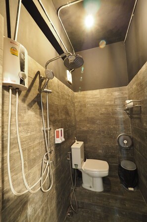 A modern bathroom with a shower, toilet, and bidet. - Zent & Bao Hostel (Bangkok)