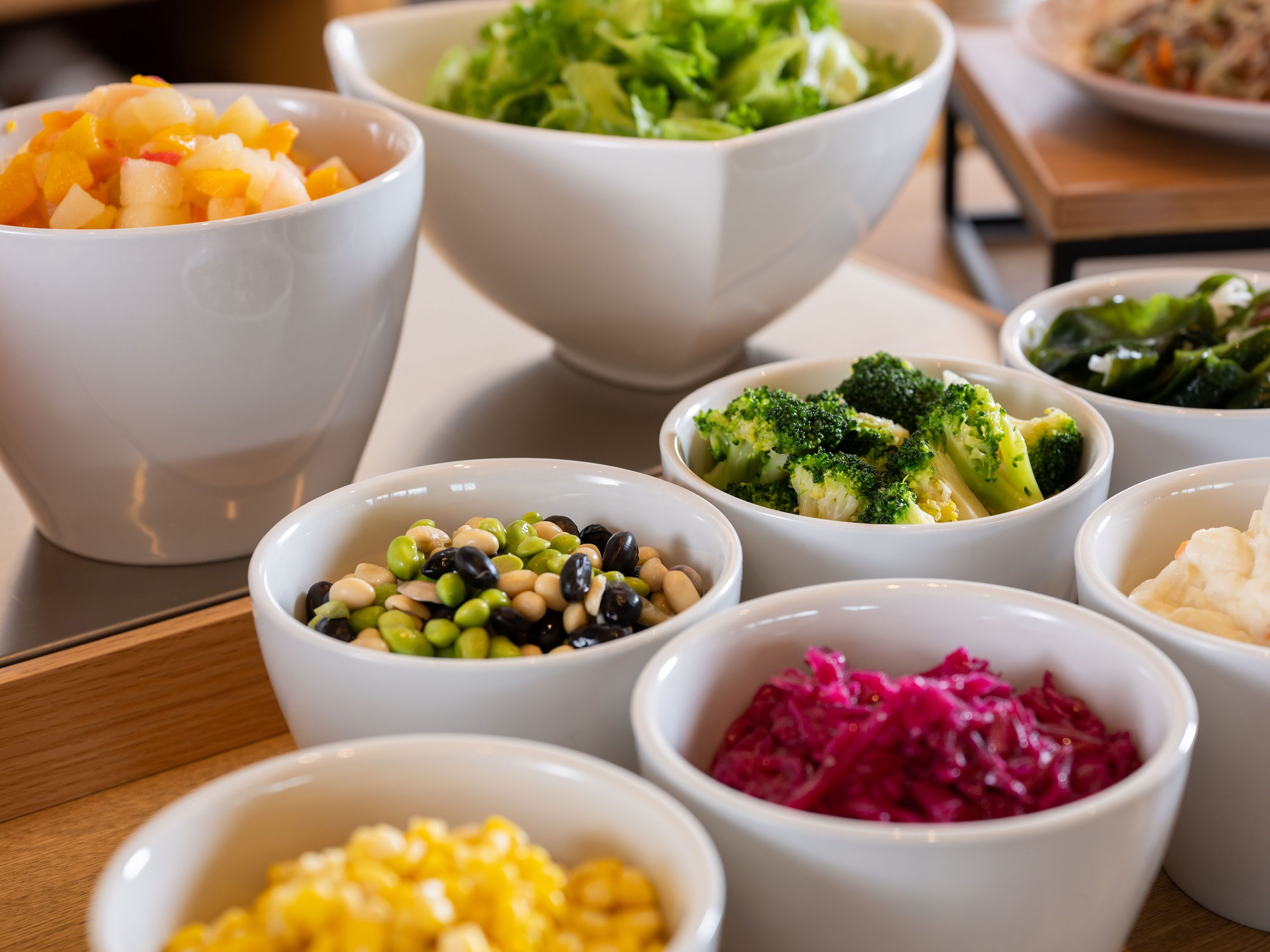 A variety of food bowls on a table.