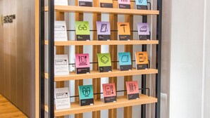 A display of various smart home devices on shelves. - HATAGO INN Shizuoka Yoshida IC (Shimada)