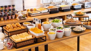 A buffet with various food items and condiments. - HATAGO INN Shizuoka Yoshida IC (Shimada)