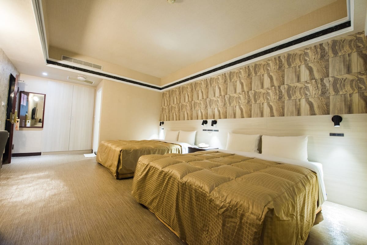 Standard Quadruple Room | Desk, laptop workspace, blackout drapes, soundproofing