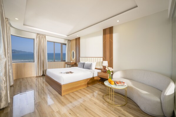 Deluxe Suite, Ocean View | Minibar, in-room safe, desk, soundproofing