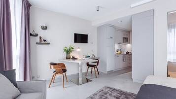 Studio Apartment Senior | Living area | Flat-screen TV
