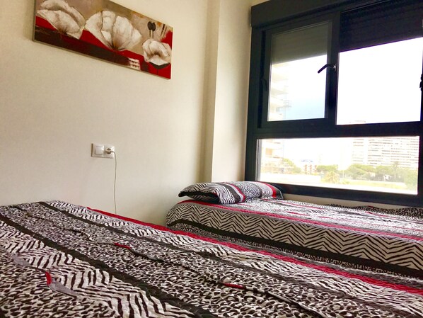 Family Apartment, 2 Bedrooms, Terrace, Partial Sea View | 2 bedrooms, desk, blackout drapes, iron/ironing board