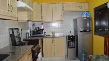 Apartment, 3 Bedrooms, Kitchen | Private kitchen | Full-size fridge, microwave, oven, stovetop