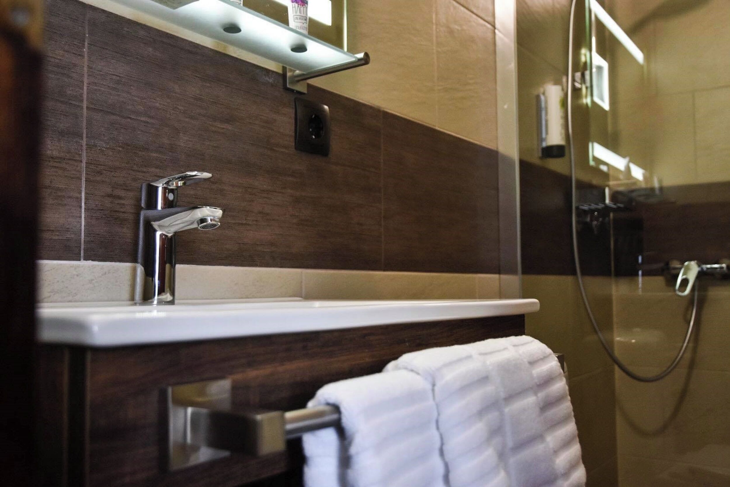 superior double room | bathroom | shower, free toiletries, hair dryer, towels