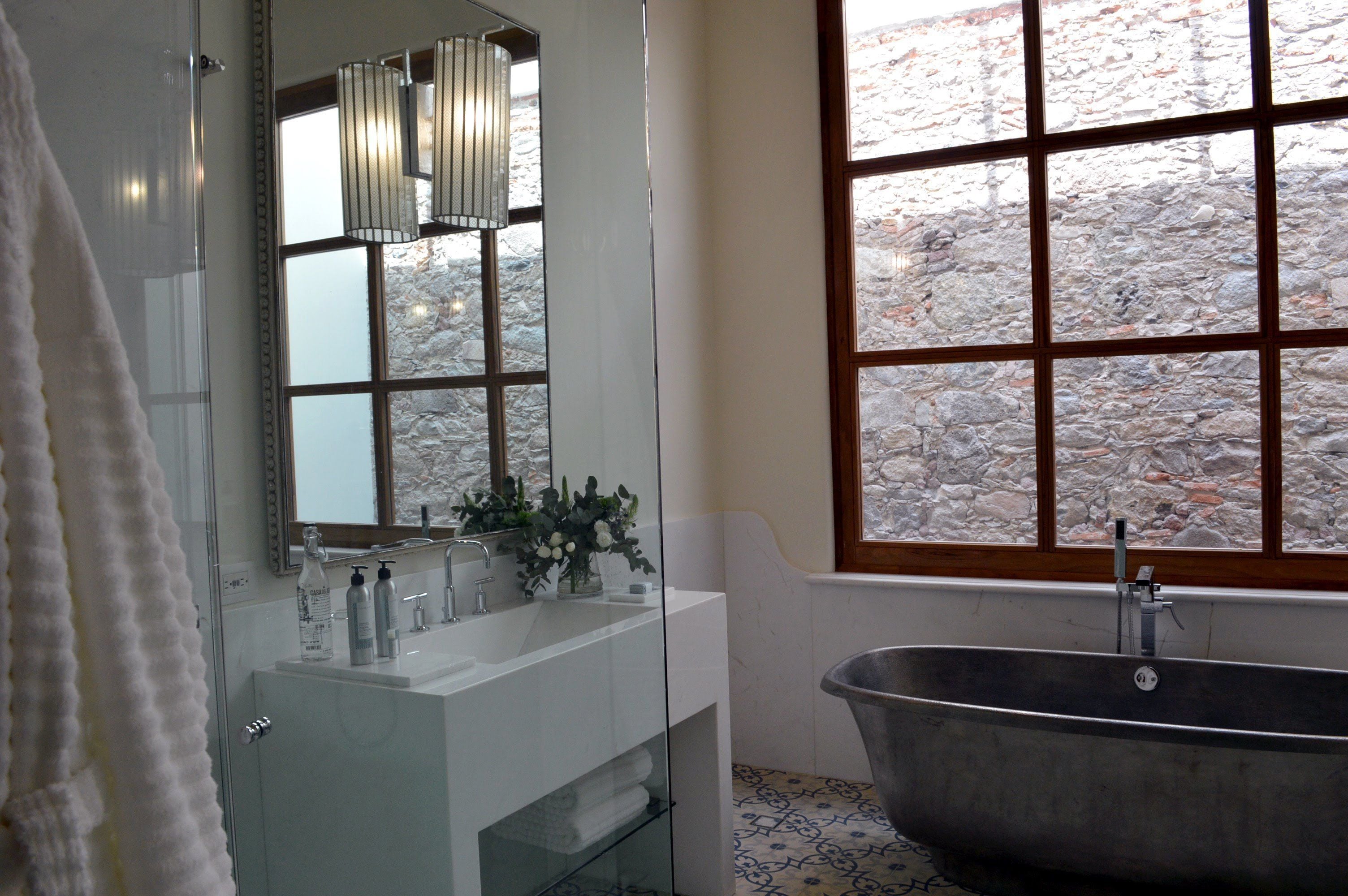 grand suite, 1 king bed | bathroom | shower, rainfall showerhead, free toiletries, hair dryer