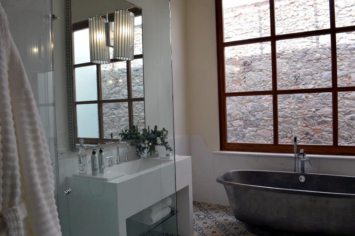 grand suite, 1 king bed | bathroom | shower, rainfall showerhead, free toiletries, hair dryer