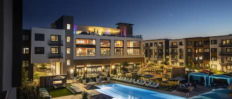 Outdoor pool, a heated pool, open 9:00 AM to 10:00 PM, pool umbrellas