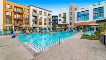 Outdoor pool, a heated pool, open 9:00 AM to 10:00 PM, pool umbrellas