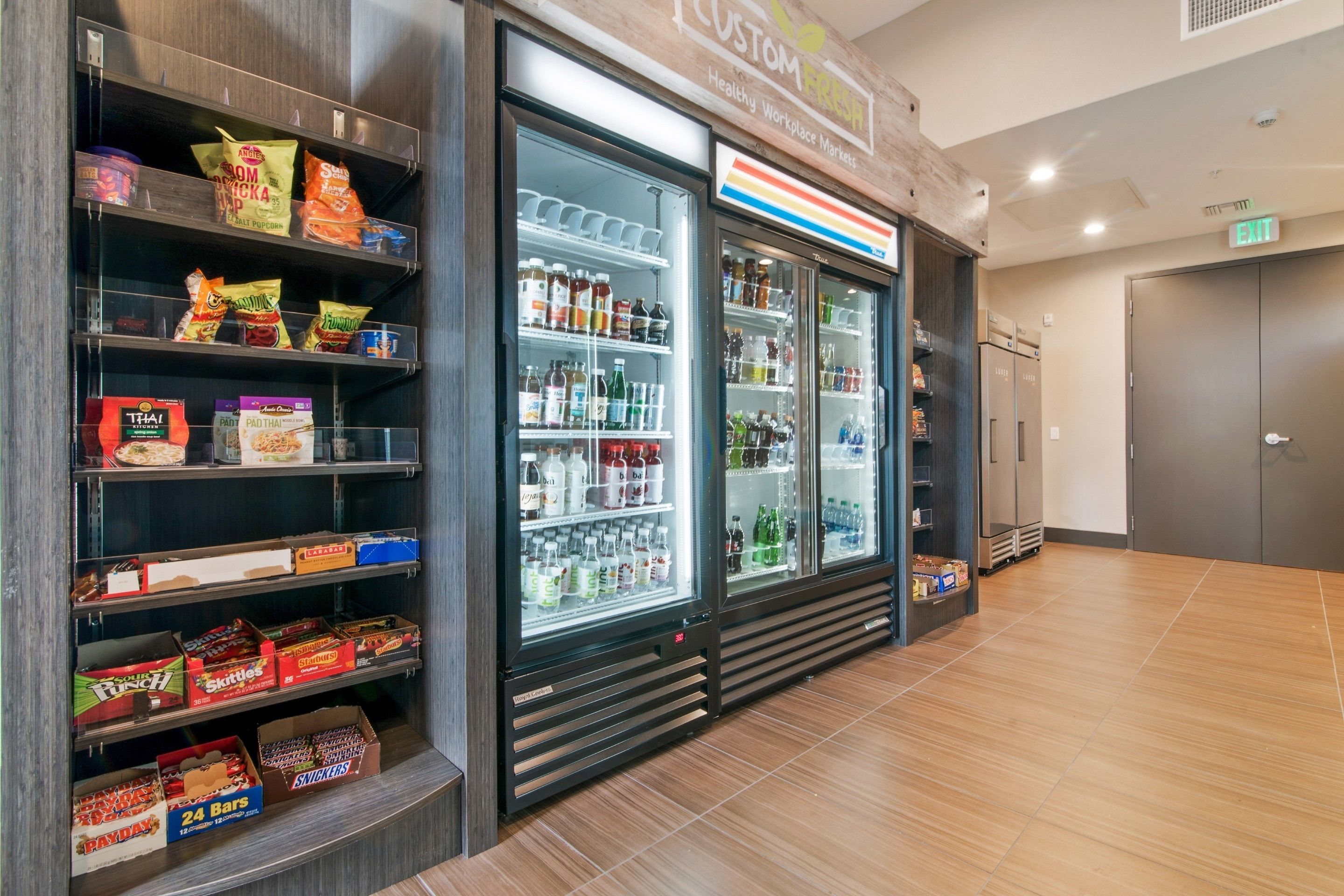 A snack and beverage vending area with various snacks and drinks.