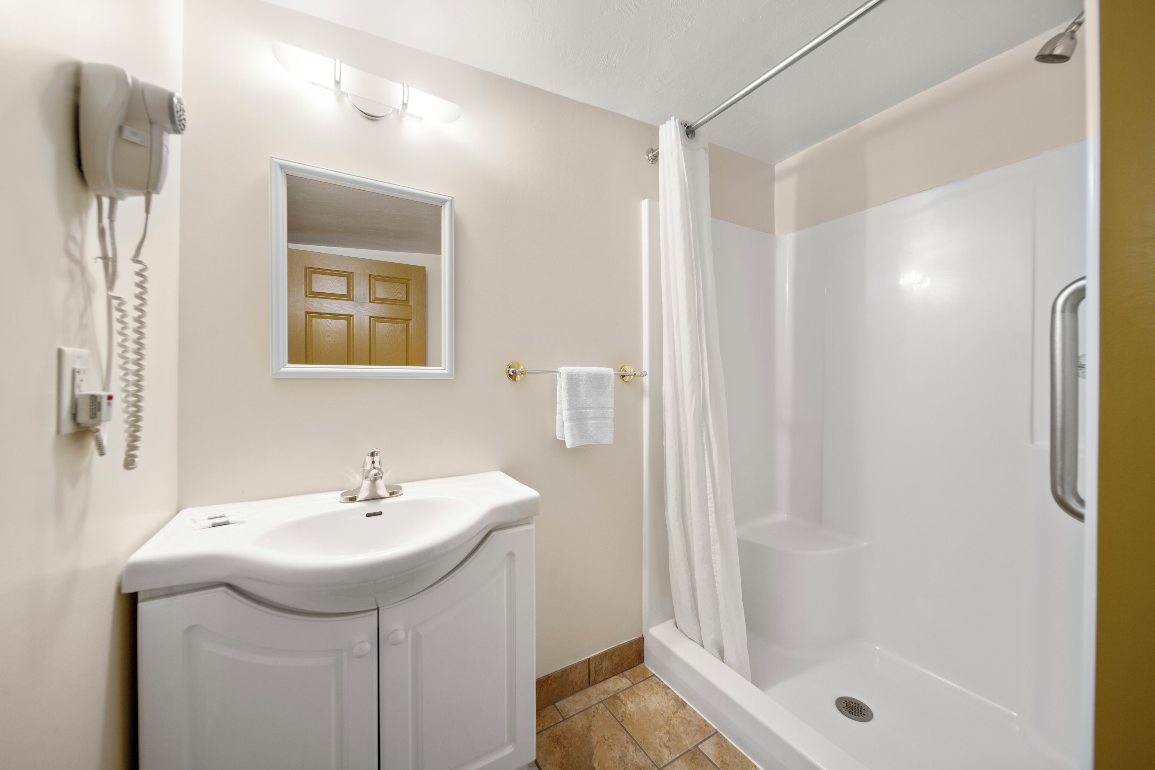 suite, 2 queen beds, kitchenette | bathroom | combined shower/bathtub, free toiletries, hair dryer, towels