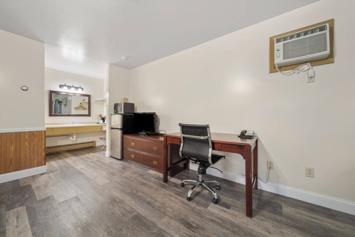 family suite, multiple beds | premium bedding, desk, iron/ironing board, rollaway beds