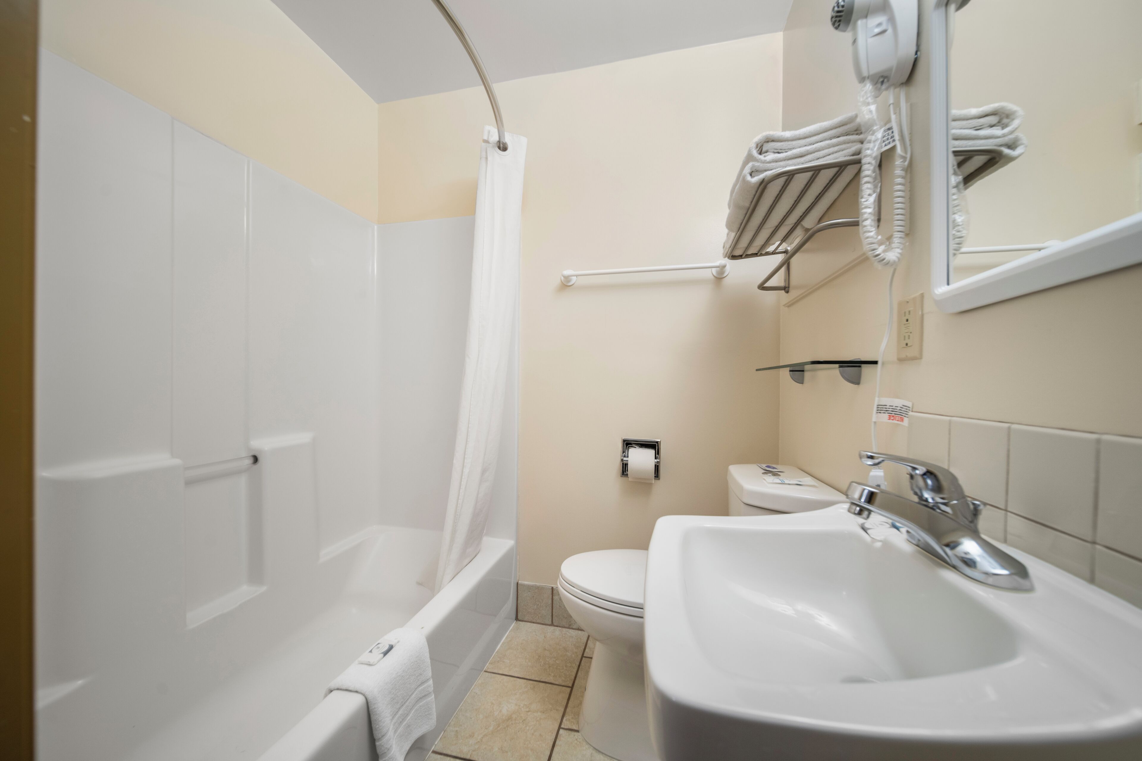 combined shower/bathtub, free toiletries, hair dryer, towels
