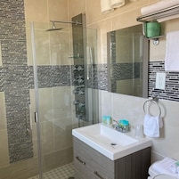 Shower, hydromassage showerhead, designer toiletries, bathrobes