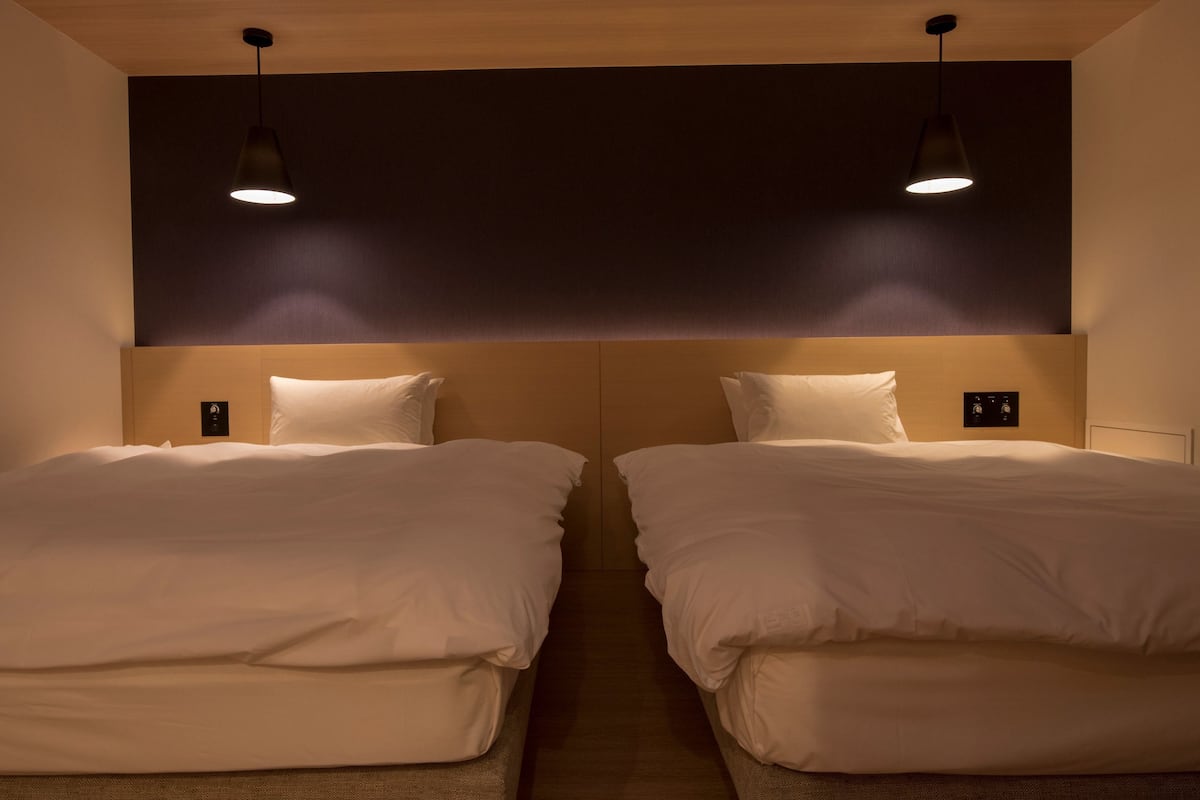 premier twin room | 1 bedroom, in-room safe, desk, iron/ironing board