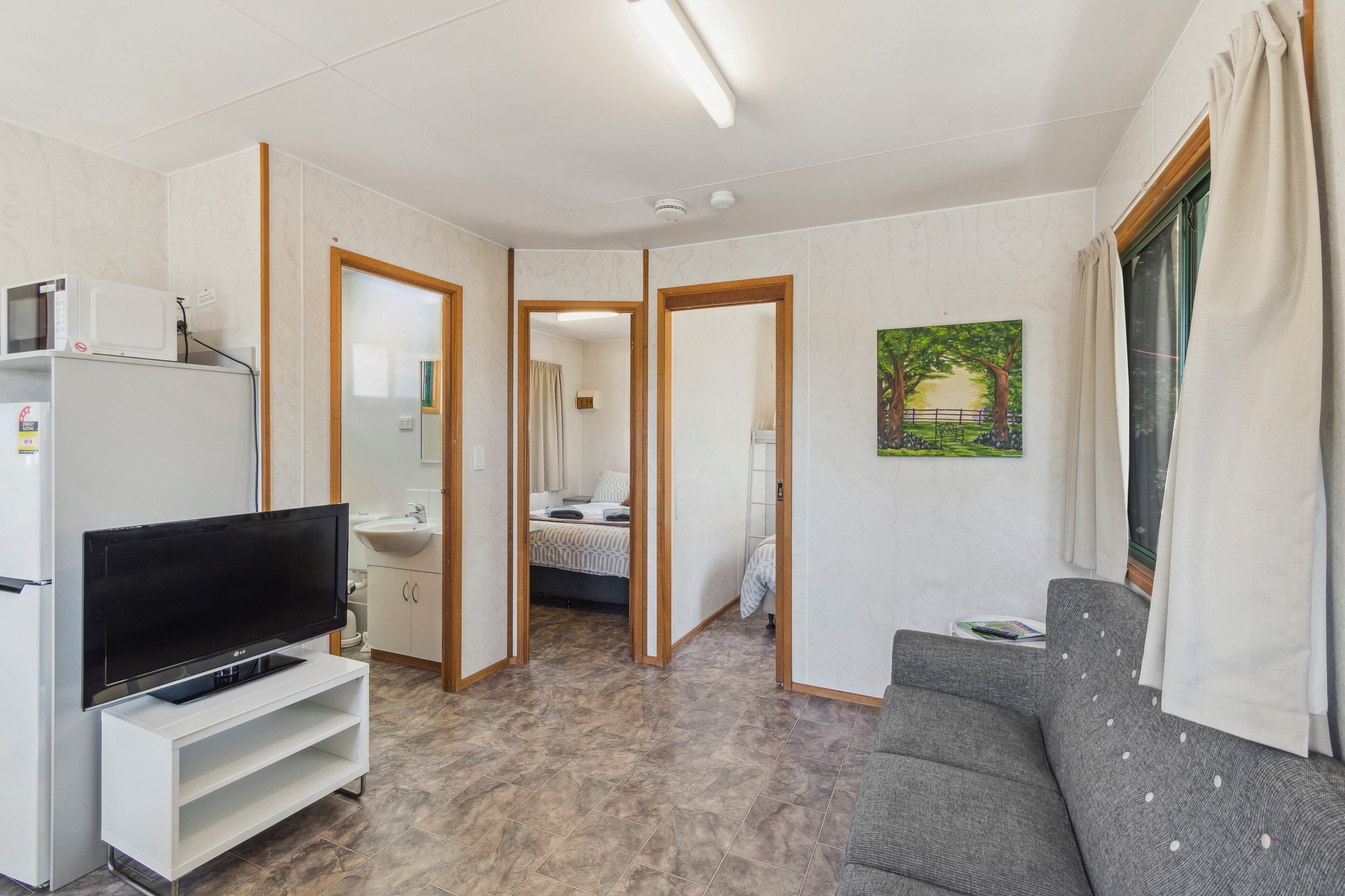 Economy 2 Bedroom Cabin - Pet Friendly | Living area | 26-inch flat-screen TV with digital channels, TV