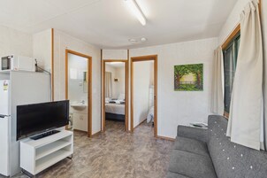 Economy 2 Bedroom Cabin - Pet Friendly | Living area | 26-inch flat-screen TV with digital channels, TV