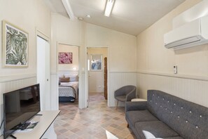 Standard 2 Bedroom Cabin - Pet Friendly | Living area | 26-inch flat-screen TV with digital channels, TV - Mittagong Holiday Park (Mittagong)