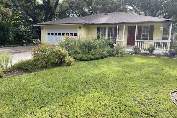 Front of the house with the butterfly gardens.