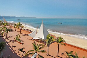 On the beach, sun-loungers, beach towels