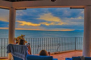 A covered balcony with a view of the sea and sky. - !!BEACHFRONT IN THE CITY CENTER! FALL 2026 SPECIAL, ONLY 245/NT!!! (Puerto Vallarta)