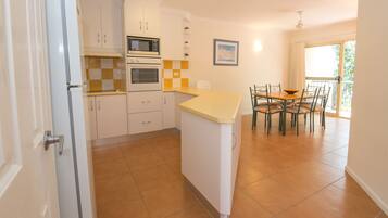 Apartment, 3 Bedrooms | Private kitchen | Full-sized fridge, microwave, oven, stovetop