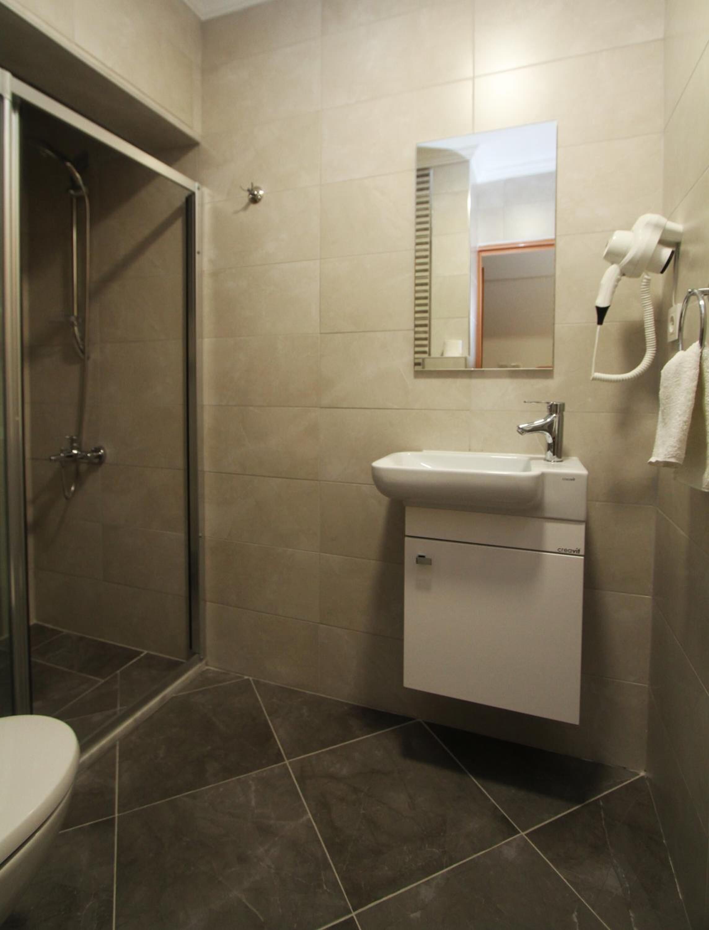 shower, free toiletries, hair dryer, slippers