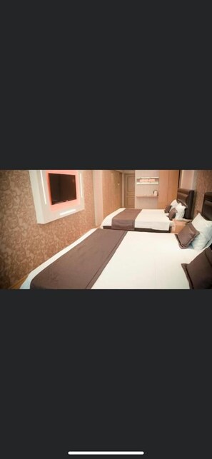 Luxe Twin kamer | Luxe beddengoed, Select Comfort-bedden, een minibar