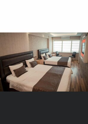 Habitación triple | 1 habitación, ropa de cama de alta calidad y camas Select Comfort 