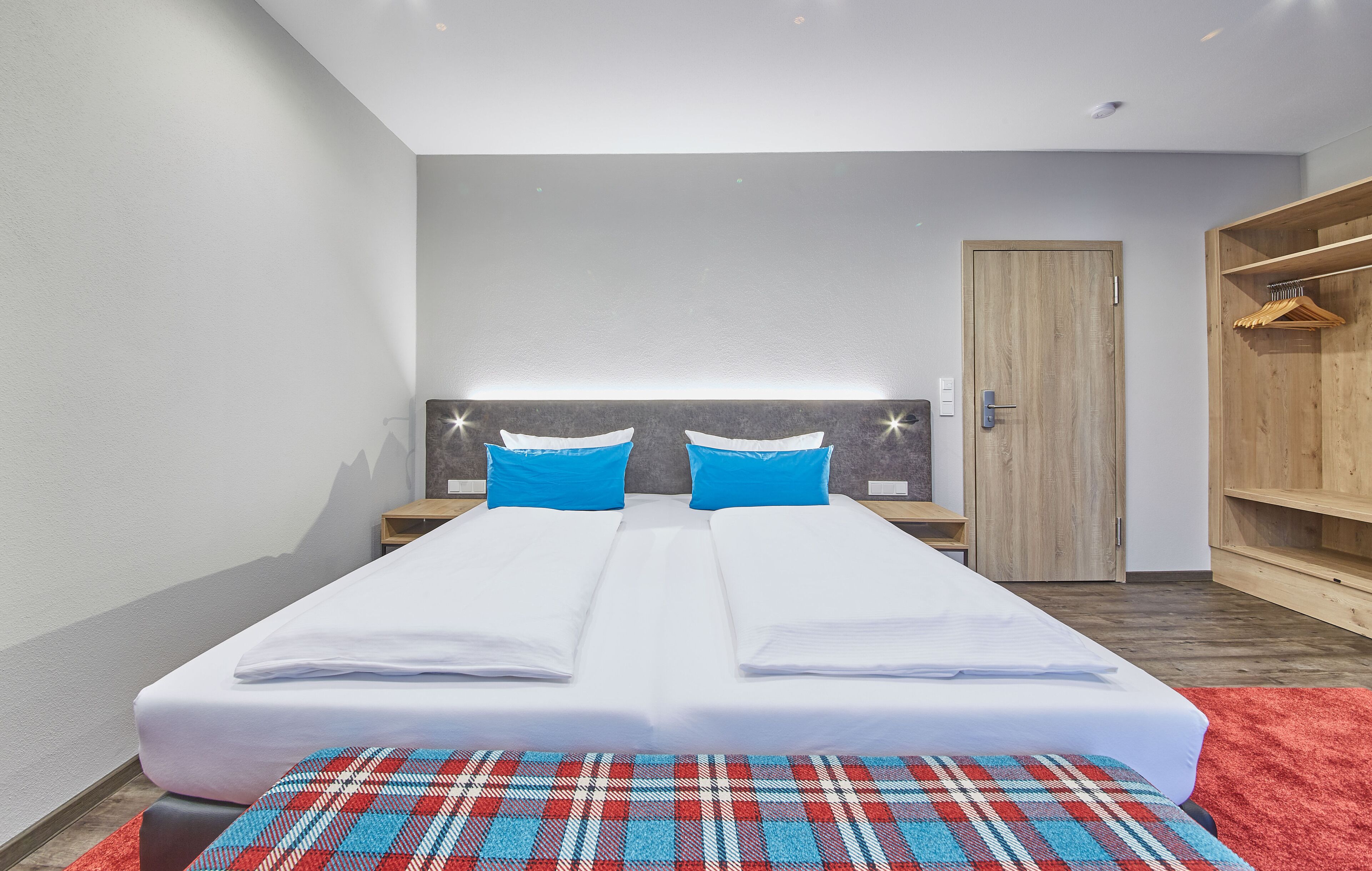 deluxe double room | living area | flat-screen tv, heated floors